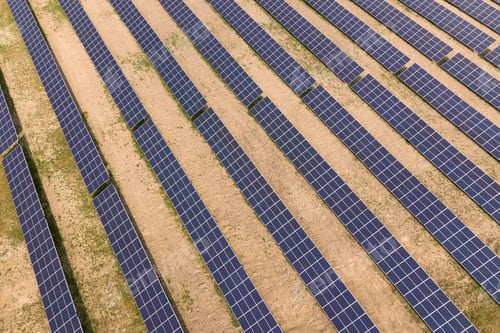 Preview: Aerial view of solar power plant. Electric panels for producing clean ecologic energy.