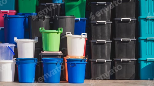 Preview: Various colors plastic buckets with multipurpose storage boxes stack in front of household shop