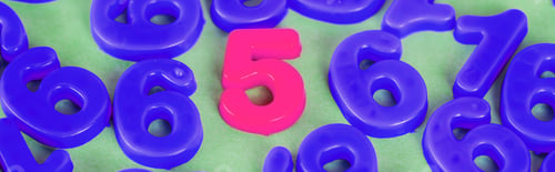 Preview: Panoramic shot of pink five number and blue numbers on green surface