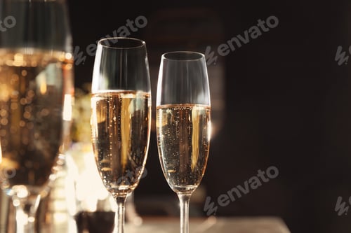 Preview: Glasses of champagne in bar. Space for text