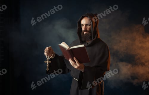 Preview: Medieval monk praying with book in church