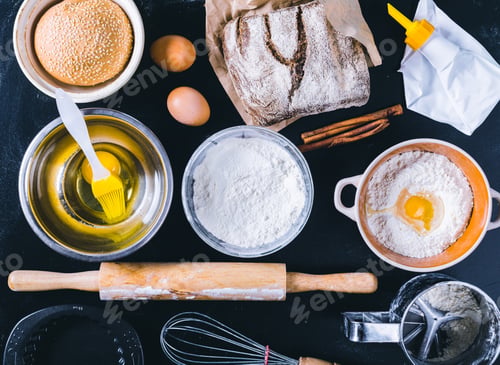 Preview: Ingredients and utensil for baking on the black board, top view
