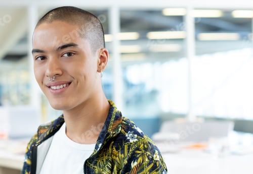 Preview: Asian male wearing floral jacket and t-shirt standing in office with monitors and glass partition