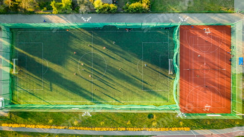 Preview: Sports field with footballers playing, aerial view of Poland