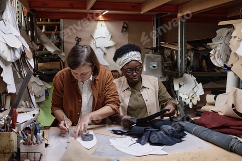 Preview: Team of dressmakers sewing clothes
