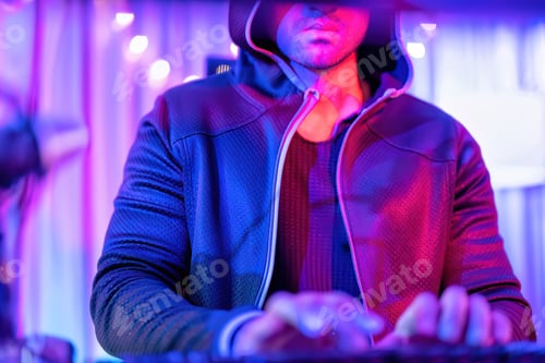 Preview: hacker wearing hood jacket typing computer keyboard to phishing steal attack