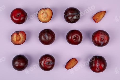 Preview: Flat lay composition with plums on purple background