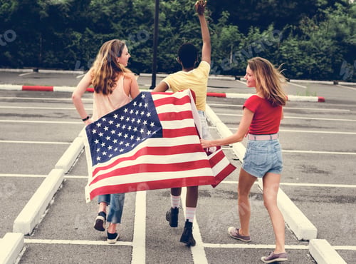 Preview: Rear view of diverse women group with American flag