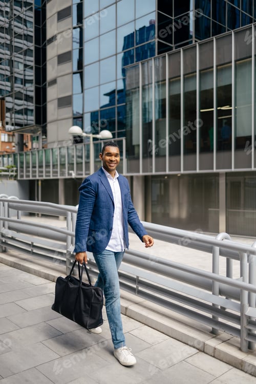 Preview: Man walking through financial area with briefcase