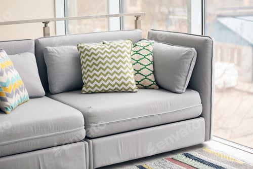 Preview: Interior of modern living room with cushions on sofa