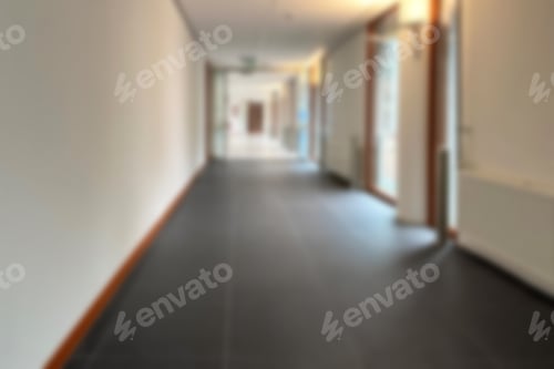 Preview: Blurred view of empty hospital corridor with doors