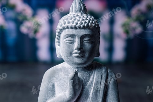 Preview: stone statue of buddha on a stone window sill surrounded by flowers and smoke - asian celebrations