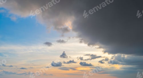 Preview: Sunset sky. Abstract nature background. Dramatic blue and orange, colorful clouds at twilight time.