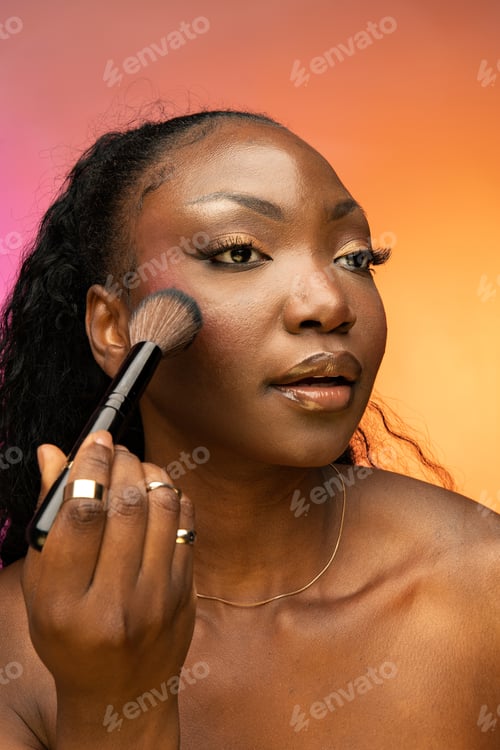 Preview: Attractive African American woman holding brush near face isolated over colorful background