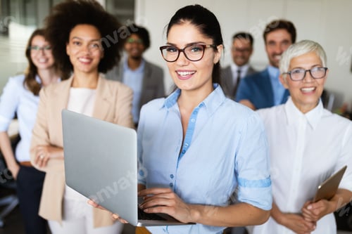 Preview: Portrait of business team posing in office