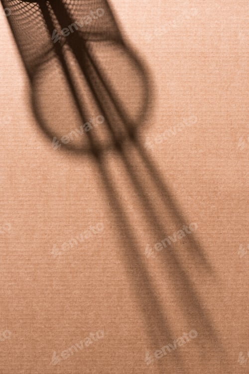 Preview: top view of shadow of desk organizer with pencils on cardboard