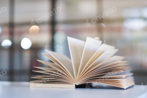 Preview: Closeup image an open book on the table