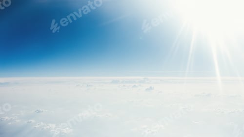 Preview: Shroud of clouds and rays of the sun view from the airplane window