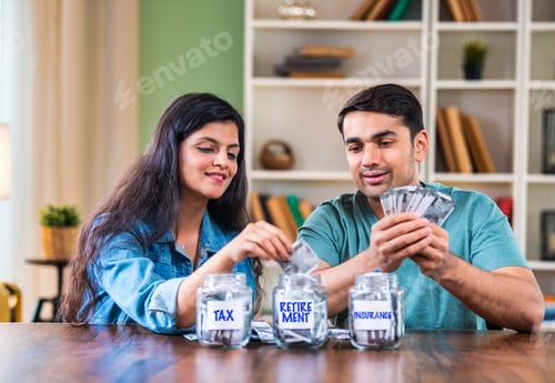Preview: Indian couple placing cash in labeled jars, symbolizing smart budgeting and investment strategies