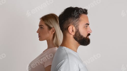 Preview: Gender equality and diverging views. Serious man and woman look in different directions