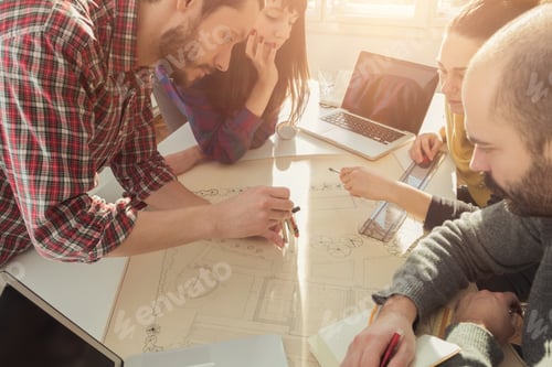 Preview: Group Of Young People / Architects Being Creative In A Small Office.