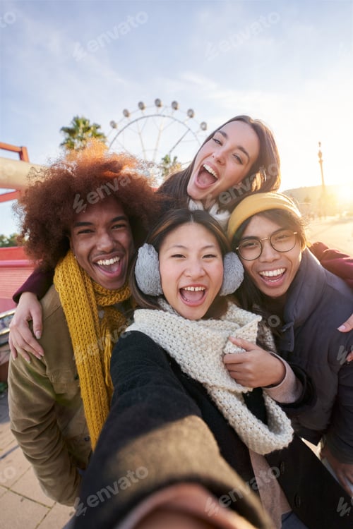 Preview: Vertical excited smiling group multiracial friends taking funny selfie looking smiling at camera.