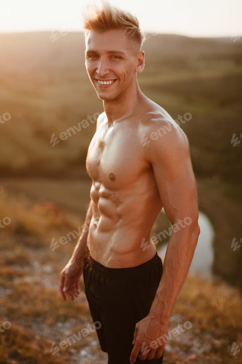 Preview: Cheerful muscular man in nature