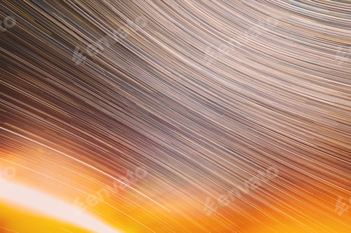 Preview: Abstract Bewitching Illusion Of Star Trails. Meteors Trace On Night Dark Blue Sky Background. Spin