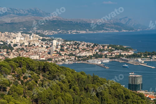 Preview: Drone view of the coastal city Split in Croatia with sea view and greenery-covered cliffs