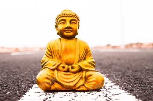 Preview: Ancient Buddha statue on the asphalt road