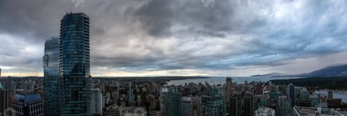 Preview: Aerial view of Downtown City during a stormy summer sunset