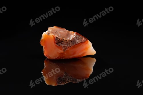 Preview: Carnelian Uncut Gem Stone on Black Background