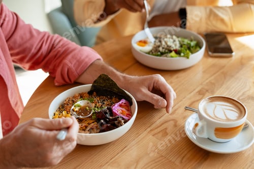 Preview: People enjoying healthy lunch and coffee in cafe