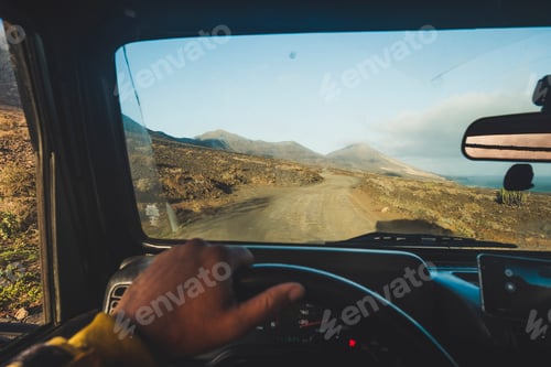Preview: Inside a car driving point of view for outdoor widl travel concept with off road vehicle