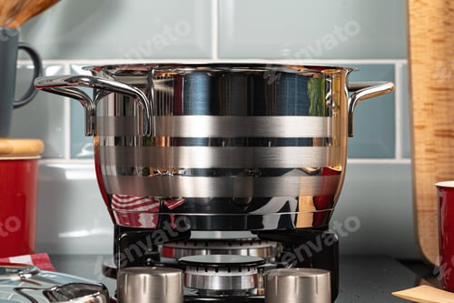 Preview: Metal pot on a gas stove burner close up