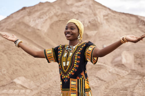 Preview: African American Girl in Traditional Clothing and Dancing in Desert