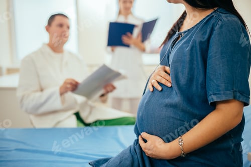 Preview: Close up of pregnant woman having diagnostic at clinic