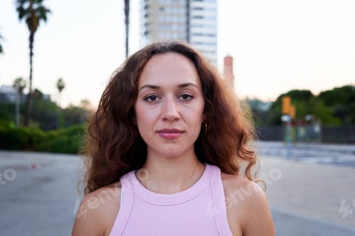 Preview: Young caucasian woman outdoors in urban city setting.