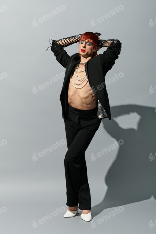 Preview: A stylish young man poses confidently, showcasing his bold fashion and charisma.