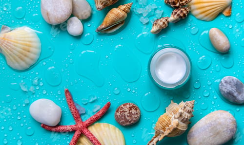 Preview: Moisturizing lotion cream on a sea background. Selective focus.