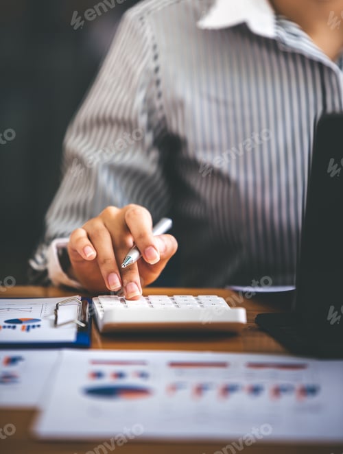 Preview: business woman or accountant who are using a calculator to calculate business data Accounting docume