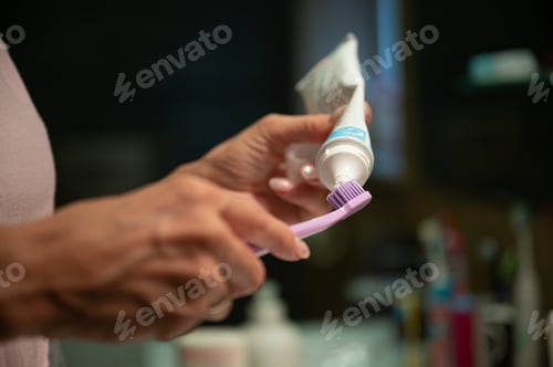 Preview: Putting toothpaste on the toothbrush