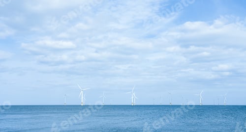 Preview: Windmill field with clouds and blue sky background, Offshore aerial view of windmill turbines