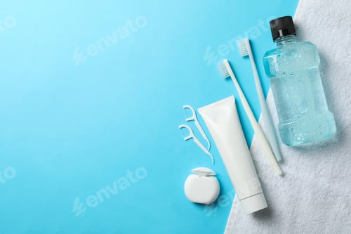 Preview: Tools for dental care on blue background, space for text