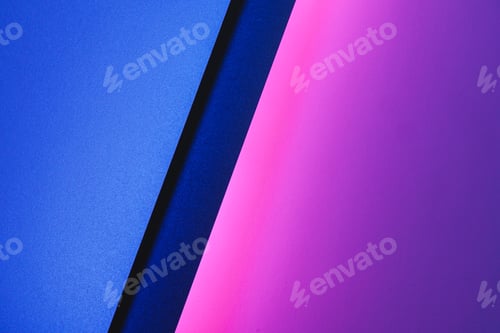Preview: Blank paper sheets rolled in a neon purple lighting