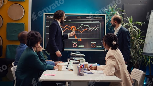 Preview: Business partners working under pressure in a boardroom