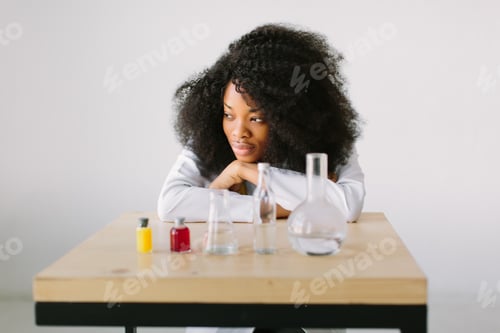 Preview: African American girl researcher chemistry student carrying out research