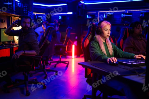Preview: Group of interracial gaming friends having lan party at cybercafe.