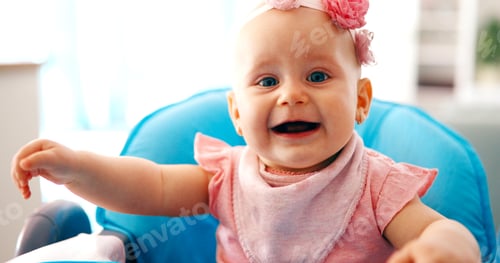 Preview: Portrait of pretty baby girl at home