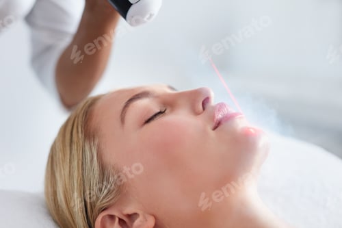 Preview: Young woman receiving local cryotherapy on her face